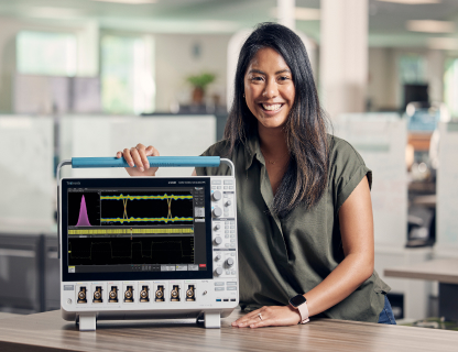 Tektronix employee with oscilloscope